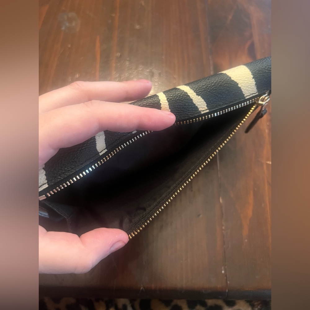 Black and white zebra print Coach wallet with authenticity